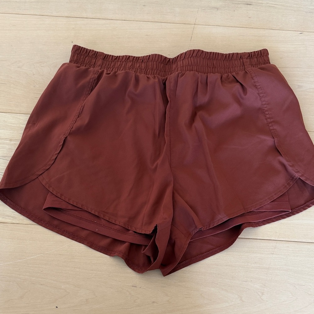 Girlfriend Collective Athletic Shorts in Rust